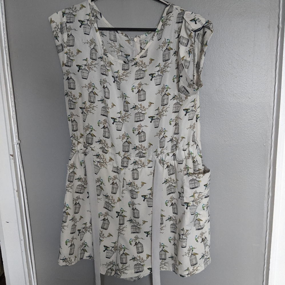 Cream-coloured romper with hummingbirds